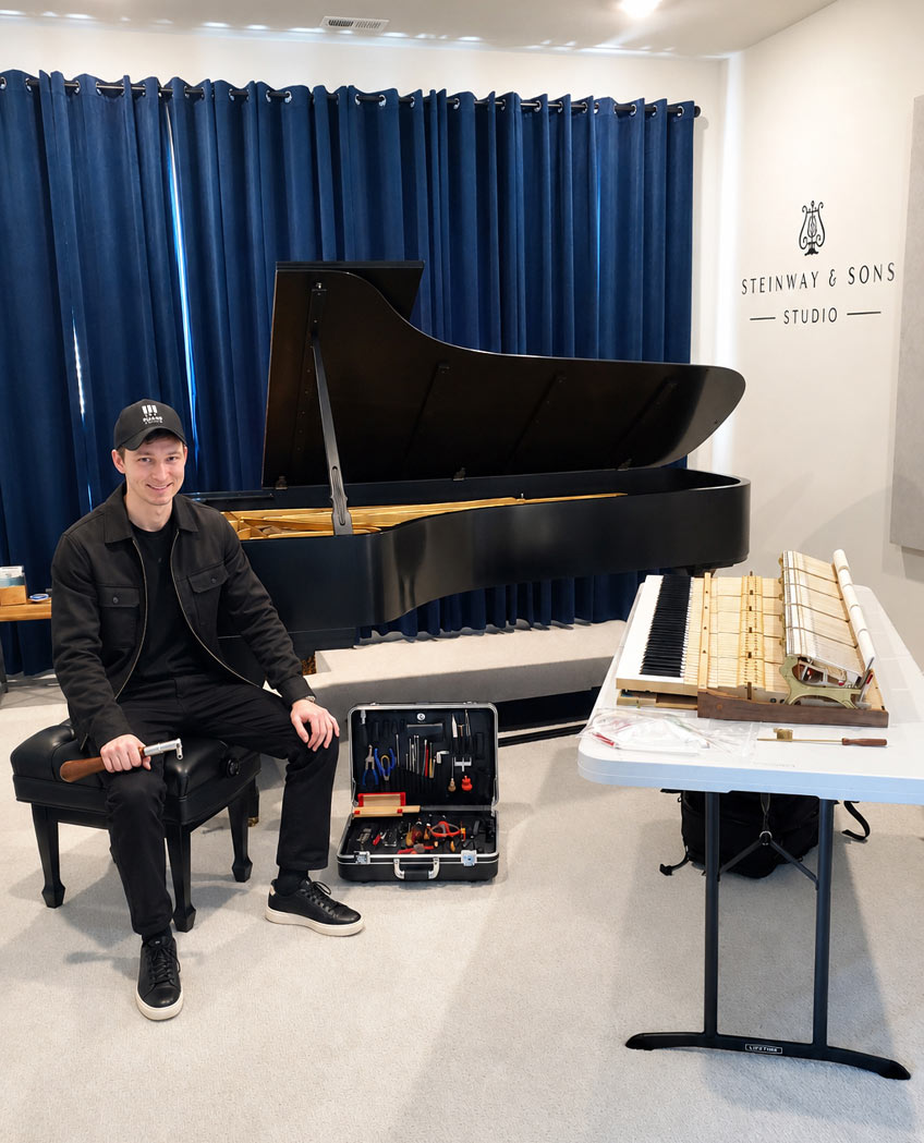 Piano tuner in Lake Stevens tuning a Steinway grand piano Piano tuner in Lake Stevens tuning a Steinway grand piano
